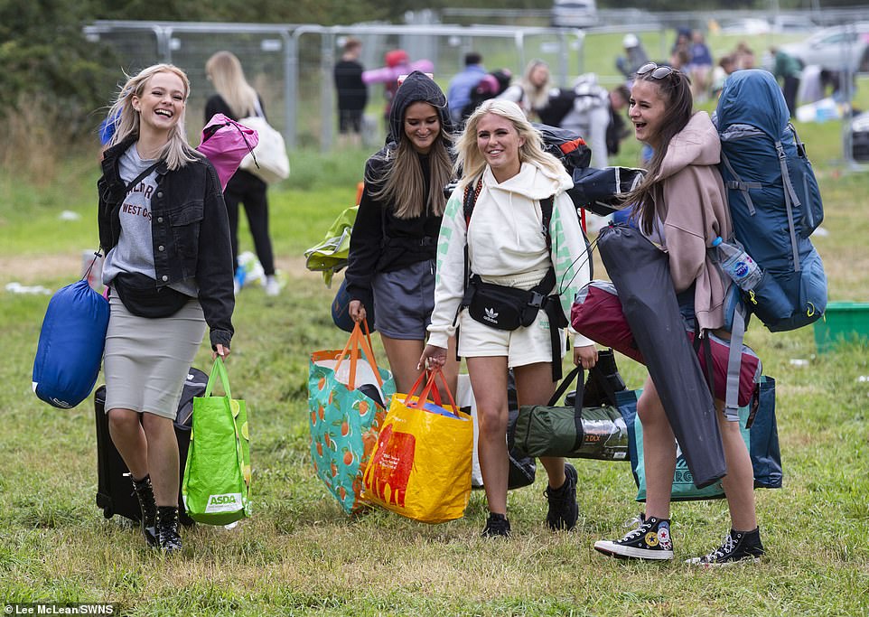 People pictured arriving at Leeds Festival in Bramham Park, West Yorkshire, this morning ahead of its first day tomorrow