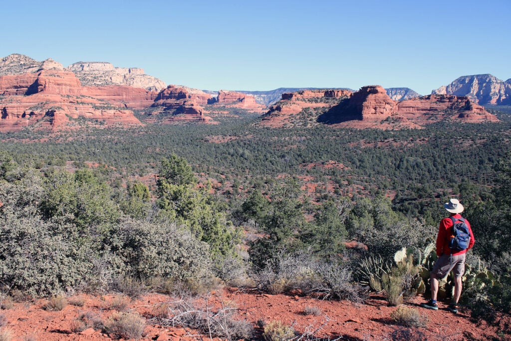 Hiking amid the red rock formations and desert landscape in Sedona, Arizona. 