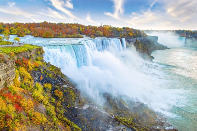 Niagara Falls including American Falls in foreground and Horseshoe Falls in background, with autumn leaf colors