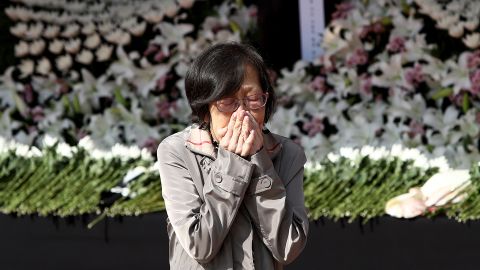 A woman pays tribute at a memorial altar on October 31 in Seoul, South Korea. 