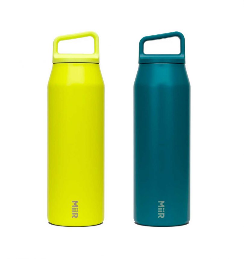 Two water bottles with angled looped handle lids in acid yellow and teal