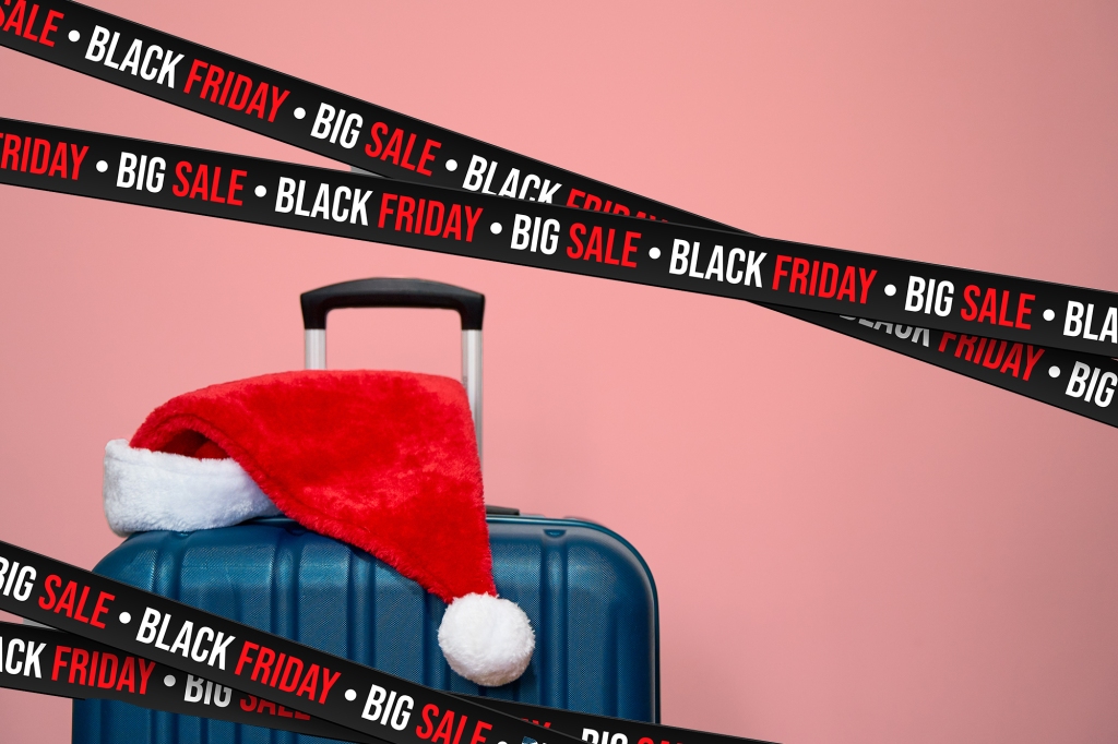 A suitcase and a santa hat with Black Friday ribbons 
