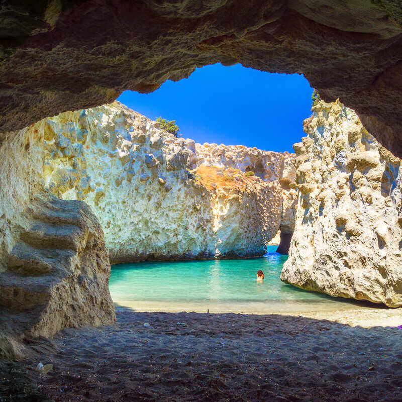 A Tourist Bathing In The Swimming Spot Facing Cave Papafragas In Milos, Cyclades Island Of Greece, Aegean Sea