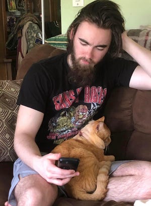 Matt Small with pet cat.