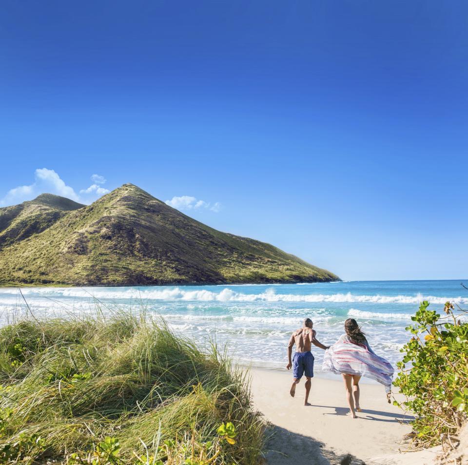 StKitts: A couple enjoying the beach in St. Kitts. Photo Courtesy St. Kitts Tourism.