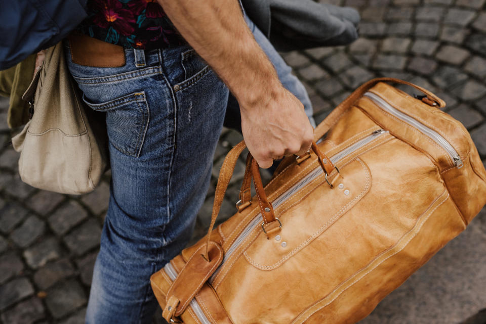 Man carrying bags and luggage travel