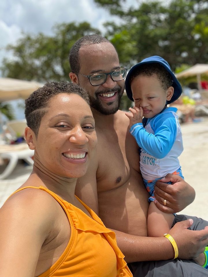 Claytor with her husband and child in Jamaica.